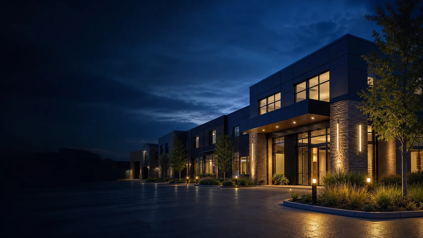 Generic modern physical asset exterior at blue hour with warm interior lights.